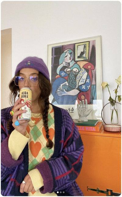 ambassador holding aura bora