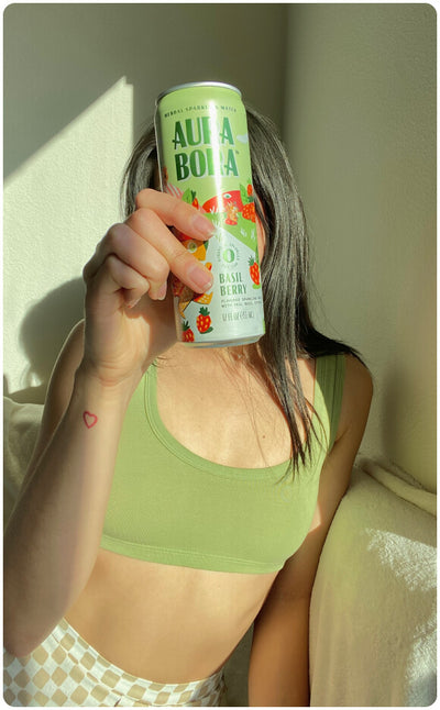 ambassador holding aura bora