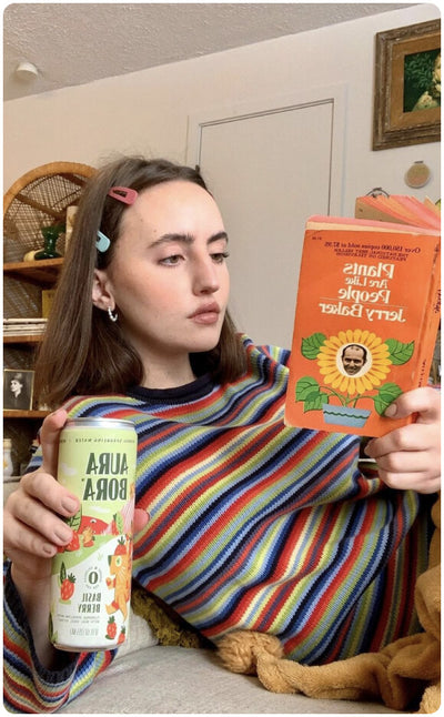 ambassador holding aura bora